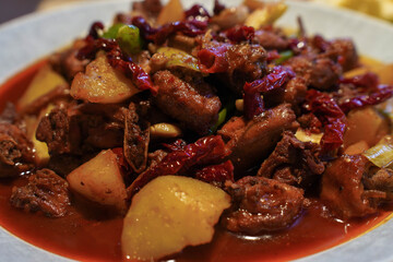 A delicious Chinese Xinjiang dish, big plate chicken