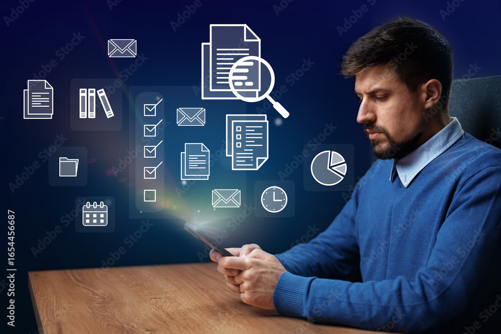 Poster professional man analyzing documents and data on portable device in modern workspace
