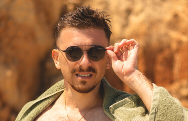 Young man enjoying vacation on the beach
