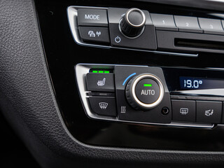 Close-Up of Heated Seat Button in Car Interior