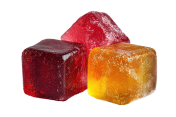 Three colorful, cubed, translucent candies.  Red, orange, and a mix of both.  Rough, crystallized surfaces.  Isolated on black