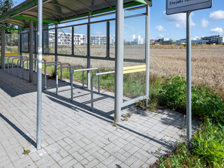 Bike racks in the city, next to the bus stop
