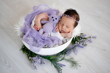 sleeping newborn baby girl in a crib, space and room for text