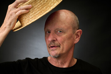 Portrait of a senior man in a vintage Harcourt style lighting
