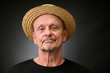 Portrait of a senior man in a vintage Harcourt style lighting