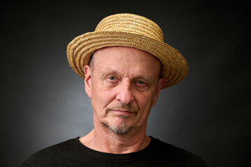 Portrait of a senior man in a vintage Harcourt style lighting