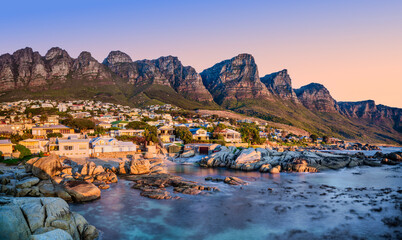 Long exposure of Beta Beach, Bakoven at sunset with turquoise water and Twelve Apostles, South Africa © Arnold