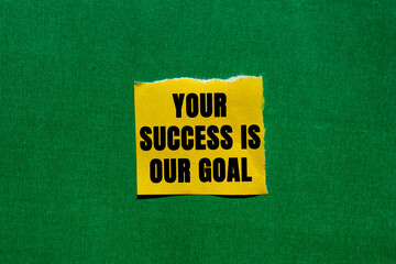 Your Success is Our Goal message written on ripped torn yellow paper piece on green background....
