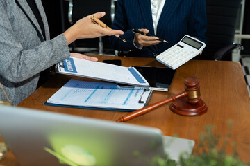 Teamwork of business lawyer meeting working hard about legal legislation in courtroom to help their customer.
