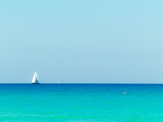 A boat in the turquoise waters of the Mediterranean Sea.