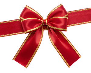 A shiny red bow with gold trim on a ribbon viewed from above against a black background in studio shot