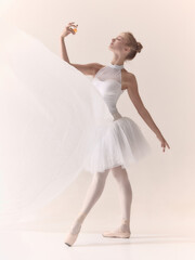 Graceful ballerina holding perfume bottle in white tutu with elegance. Concept of fragrance, luxury...