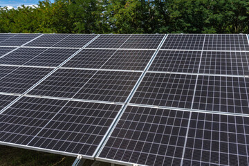 Photovoltaic solar panels installed in front of the house in the garden,