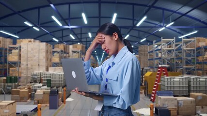 Side View Of Asian Female Professional Worker Use Laptop in Warehouse with Rows of Shelving,  She Is Nodding Her Shead With Dissapionted - Powered by Adobe