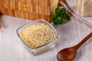 Raw dry sesame seeds heap
