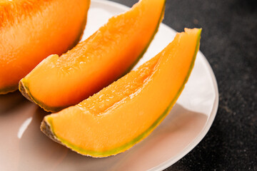 Melon Charente ripe sweet fruit tasty snack fresh delicious gourmet food background on the table rustic food top view copy space keto and paleo diet vegan and vegetarian food