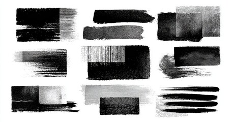 Abstract ink and paint brushstrokes in various shades of gray and black on white background