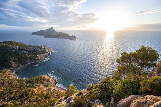 View of mountains and coast with sea, in the evening light, hiking to La Trapa from Sant Elm, at the back island Sa Dragonera, Serra de Tramuntana, Majorca, Spain