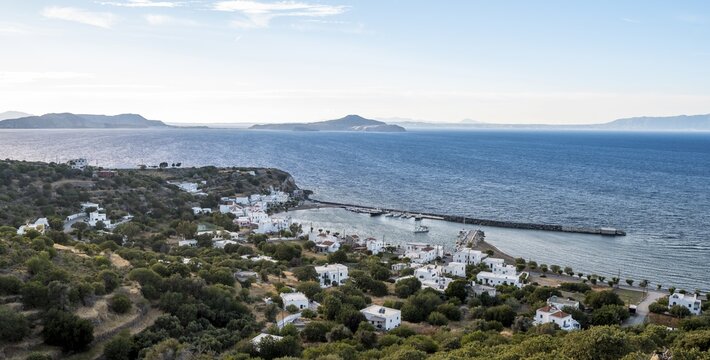 View of the village and harbour of Pali, view over the sea to Gyali Island, Nisyros, Dodecanese, Greece