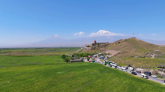 07.07.2025 Armenia Khor Virap monastery. Drone view Khor Virap monastery in Armenia, West Asia. Touristic buses, peoples near monastery. Khor Virap with Ararat mountain background.  
