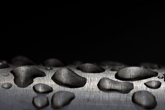 Water droplets on a stainless steel pipe