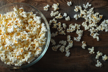 Popcorn on wood color background.Food and snack concepts ideas.Minimal style top view mockup