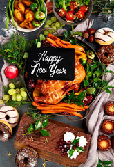 Festive dinner table with roasted chicken. Christmas family dinner.