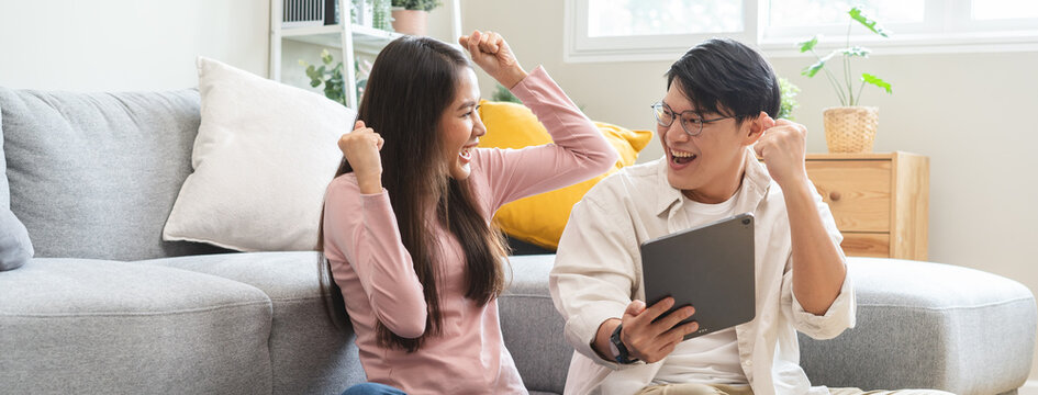 financial in family concept, Happy Asian husband and wife calculating income and bills to plan for investment.