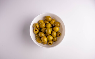 green olives in white bowl