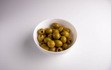 green olives in white bowl