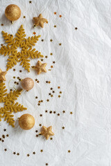 christmas decorations on paper texture background, gold snowflake, Christmas ball, gold glitter.