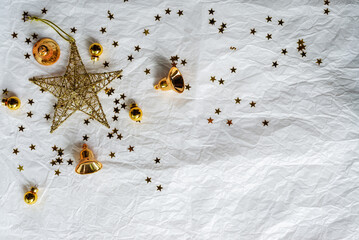 Gold Christmas theme decoration on paper texture background, gold star, star glitter, Christmas bell.