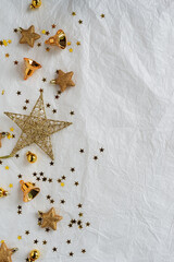 Gold Christmas theme decoration on paper texture background, gold star, star glitter, Christmas bell.