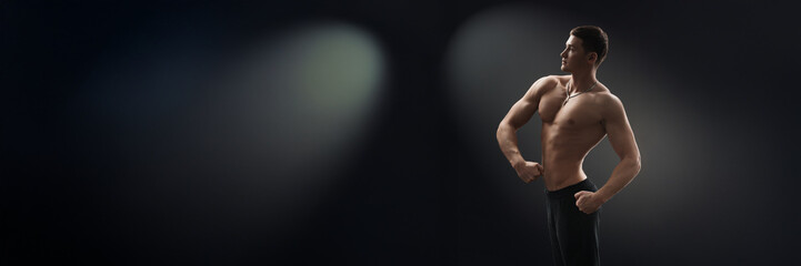 Naklejka premium Confident Pose of Muscular Man Wide Banner with Copy Space