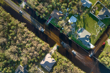Flooded road in Florida after heavy hurricane rainfall. Aerial view of evacuating cars and...