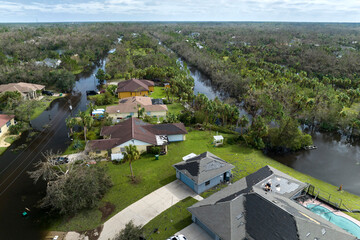 Consequences of natural disaster. Heavy flood with high water surrounding residential houses after...