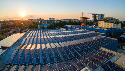 Blue photovoltaic solar panels mounted on building roof for producing clean ecological electricity...