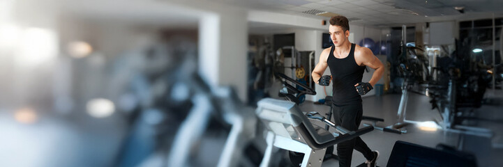 Man Exercising on Treadmill in Gym, Wide Banner