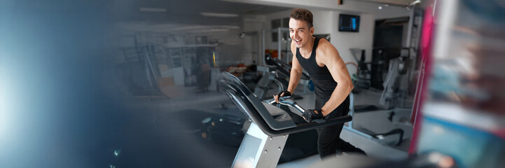 Energetic Man Exercising in Gym Wide Banner with Copy Space