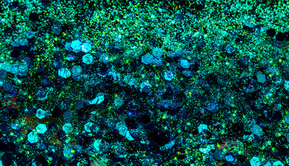 Green sparkles on black background