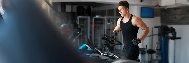 Man Running on Treadmill in Gym Wide Banner