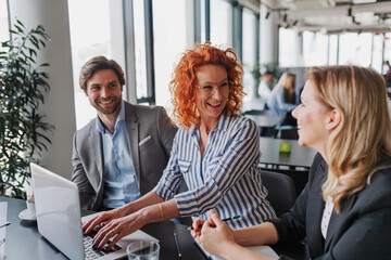 Group of coworkers discussing project strategy.