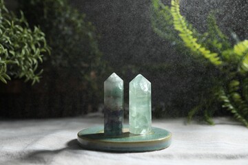 Aura. Two beautiful crystal on beige fabric