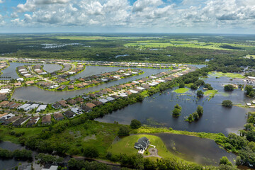 Flooding in Florida caused by tropical storm from hurricane rainfall. Suburb houses in residential...