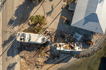 Destroyed sailing yacht capsized on shallow bay waters after hurricane Milton on Manasota Key in...