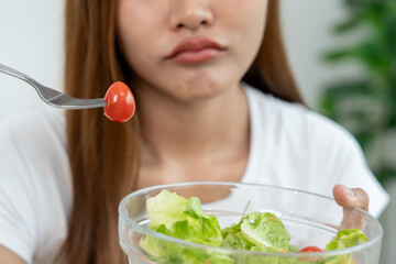 slim body asian women very bored diet food, dieting female choose low calories food for diet. Good...