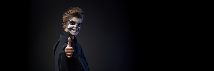 Boy in Skull Makeup Giving Thumbs Up, Wide Banner