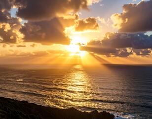 Spectacular sunset over the ocean with vibrant sunrays piercing through the clouds creating golden