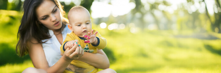 Mother with Baby Outdoors Wide Banner