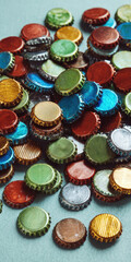 Colorful metal bottle cap collection scattered on blue surface, vibrant and shiny, creating playful and nostalgic mood, ideal for recycling or creative craft concepts